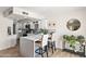 Bright kitchen featuring a breakfast bar, pendant lights, and modern countertops at 841 E Peoria Ave # 2, Phoenix, AZ 85020