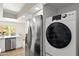 This kitchen shows a side-by-side stainless refrigerator, washer, and dryer at 841 E Peoria Ave # 2, Phoenix, AZ 85020