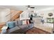 Inviting living room with modern furnishings, stylish decor, and staircase access at 841 E Peoria Ave # 2, Phoenix, AZ 85020