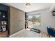 Well-lit office area featuring a large built-in cabinet and scenic outdoor view at 841 E Peoria Ave # 2, Phoenix, AZ 85020