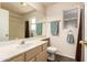 Bathroom with a sink, mirror, and well-placed towel racks at 8569 W Fullam St, Peoria, AZ 85382