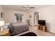 Bright bedroom with ceiling fan, neutral paint, and window creating a calming atmosphere at 8569 W Fullam St, Peoria, AZ 85382