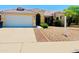 Inviting single-Gathering home featuring a well-maintained front yard and attached two-car garage at 8569 W Fullam St, Peoria, AZ 85382