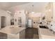 Bright kitchen features neutral colored cabinets, stainless steel appliances, and an eat-in breakfast bar at 8569 W Fullam St, Peoria, AZ 85382