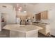 Kitchen featuring an electric stove, tile flooring, and neutral colored cabinets at 8569 W Fullam St, Peoria, AZ 85382