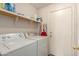 Laundry room equipped with modern appliances and ample storage space at 8569 W Fullam St, Peoria, AZ 85382