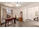 Office with a large window and a ceiling fan, providing both style and functionality at 8569 W Fullam St, Peoria, AZ 85382