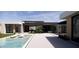 Luxurious backyard with a refreshing pool, comfortable lounge chairs, and modern architecture, perfect for relaxation at 8618 E Irish Hunter Trl, Scottsdale, AZ 85258