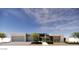 Contemporary home featuring a clean facade with a two-car garage, manicured landscaping, and a welcoming entrance at 8618 E Irish Hunter Trl, Scottsdale, AZ 85258