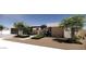 Modern exterior featuring sleek lines, desert landscaping, and a welcoming entrance that exudes contemporary elegance at 8618 E Irish Hunter Trl, Scottsdale, AZ 85258