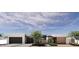 Stunning contemporary home featuring clean lines, neutral colors, and desert landscaping for modern curb appeal at 8618 E Irish Hunter Trl, Scottsdale, AZ 85258