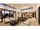 Bright open-concept living area featuring modern furniture, a dining area, and seamless indoor-outdoor flow at 8618 E Irish Hunter Trl, Scottsdale, AZ 85258
