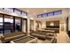 Open-concept living area featuring sleek sofas, dining space, modern lighting, and expansive windows for natural light at 8618 E Irish Hunter Trl, Scottsdale, AZ 85258