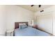 This charming bedroom has a single bed, a lighted vanity, and sliding closet doors at 9028 E Altadena Ave, Scottsdale, AZ 85260