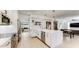 Spacious open kitchen with a large center island, stainless steel appliances and bar stool seating at 9028 E Altadena Ave, Scottsdale, AZ 85260