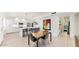 Modern kitchen features white cabinets, stainless steel appliances, and a large island with bar seating at 9028 E Altadena Ave, Scottsdale, AZ 85260