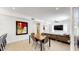 Open living space featuring dining area and seamless flow into the adjacent kitchen and living room at 9028 E Altadena Ave, Scottsdale, AZ 85260