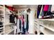 Organized walk-in closet featuring ample storage, shelving, and hanging space for clothing and accessories at 9028 E Altadena Ave, Scottsdale, AZ 85260