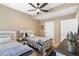 Cozy bedroom featuring two twin beds, a ceiling fan, and neutral decor at 9550 E Thunderbird Rd # 152, Scottsdale, AZ 85260