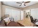 Well-lit bedroom with a ceiling fan, closet space, and neutral decor, providing a peaceful retreat at 9550 E Thunderbird Rd # 152, Scottsdale, AZ 85260
