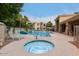 Relaxing community pool area with sun loungers, well-kept landscaping, and inviting lounge areas at 9550 E Thunderbird Rd # 152, Scottsdale, AZ 85260