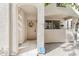 Charming entryway with covered porch, decorative wreath, and security system provides a warm welcome to the property at 9550 E Thunderbird Rd # 152, Scottsdale, AZ 85260