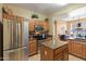 Well-equipped kitchen featuring stainless steel appliances, granite countertops, and ample cabinet space at 9550 E Thunderbird Rd # 152, Scottsdale, AZ 85260