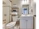 Neat bathroom featuring a shower-tub combo, white vanity, and chrome fixtures at 1027 S Siesta Ln, Tempe, AZ 85281