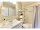 Cozy bathroom with shower, tiled walls, and towel storage at 1027 S Siesta Ln, Tempe, AZ 85281