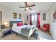 Comfortable bedroom with ceiling fan, gray upholstered bed, and stylish decor at 1027 S Siesta Ln, Tempe, AZ 85281
