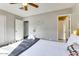 Inviting bedroom featuring neutral walls, a ceiling fan, and ample natural light at 1027 S Siesta Ln, Tempe, AZ 85281