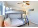Bright bedroom featuring a bunk bed, ceiling fan, and lots of natural light at 1027 S Siesta Ln, Tempe, AZ 85281