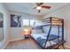 Bedroom featuring a bunk bed and neutral walls with lots of sunlight from the window at 1027 S Siesta Ln, Tempe, AZ 85281