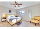 Cozy bedroom with soft carpet, a ceiling fan, and a sunny window at 1027 S Siesta Ln, Tempe, AZ 85281