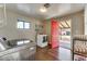 Spacious laundry room with modern washer and dryer, and access to the backyard at 1027 S Siesta Ln, Tempe, AZ 85281