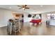 Spacious living area featuring hardwood floors, neutral walls, and an open layout to dining area at 1027 S Siesta Ln, Tempe, AZ 85281