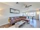 Open-concept living room with hardwood floors, ample natural light, and modern furniture at 1027 S Siesta Ln, Tempe, AZ 85281