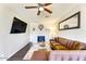 Comfortable living room featuring dark floors, a fire place, and a flat screen tv at 1027 S Siesta Ln, Tempe, AZ 85281