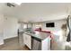 Open layout featuring living, dining, and kitchen areas with hardwood floors and modern finishes at 1027 S Siesta Ln, Tempe, AZ 85281