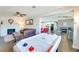 Large entertainment space featuring a fireplace, air hockey table, and open access to kitchen and dining at 1027 S Siesta Ln, Tempe, AZ 85281