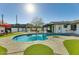 Inviting pool with landscaped surroundings, lounge chairs, and clear blue water at 1027 S Siesta Ln, Tempe, AZ 85281