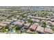 Expansive aerial view of a residential area with many homes, pools and mature trees in a well-established neighborhood at 10430 W Los Gatos Dr, Peoria, AZ 85383