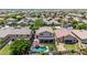 Aerial view of a home with a pool, patio, and landscaped backyard nestled in a vibrant residential community at 10430 W Los Gatos Dr, Peoria, AZ 85383