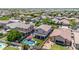 Aerial view of a beautiful property featuring a pool, patio and lush landscaping in a desirable neighborhood at 10430 W Los Gatos Dr, Peoria, AZ 85383