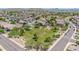 Aerial view of a park with lots of grass and trees in a Gathering-friendly neighborhood with mountain views at 10430 W Los Gatos Dr, Peoria, AZ 85383