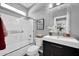 Bathroom features a shower and tub, and sleek vanity with a modern sink and fixtures at 10430 W Los Gatos Dr, Peoria, AZ 85383