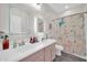This bathroom offers a double-sink vanity and a colorful shower curtain, creating a playful and functional space at 10430 W Los Gatos Dr, Peoria, AZ 85383