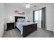 This bedroom features elegant decor, a dark-wood bed frame, and soft lighting for relaxation and comfort at 10430 W Los Gatos Dr, Peoria, AZ 85383