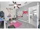 Spacious bedroom with ceiling fan and plenty of space for play and creativity at 10430 W Los Gatos Dr, Peoria, AZ 85383