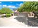 Charming two-story home with a well-manicured lawn, mature trees and a spacious three car garage at 10430 W Los Gatos Dr, Peoria, AZ 85383